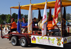 Truck trailer float with flags and Shriners decals